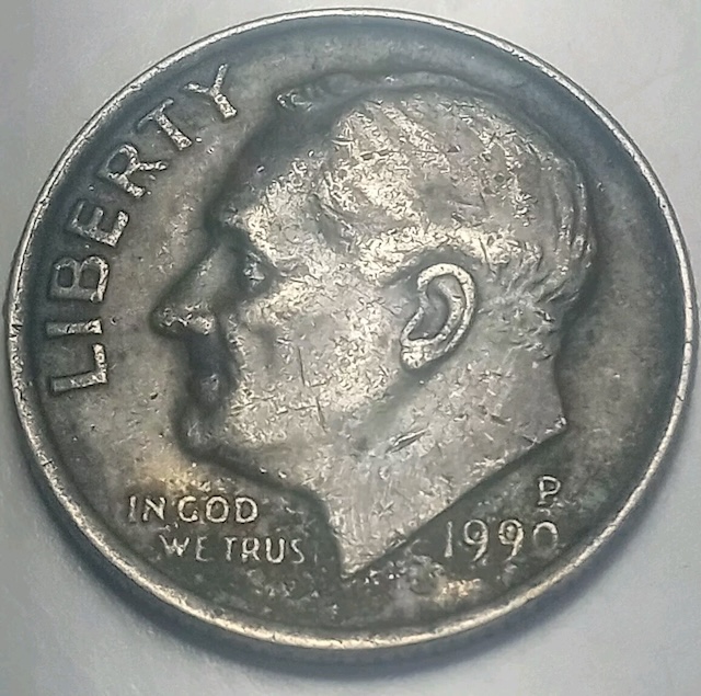 1990 dime missing clad layer error showing copper core on one side
